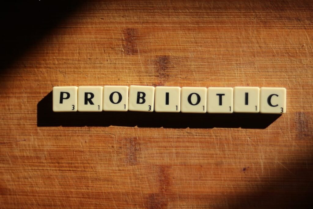 Probiotic letter tiles on wooden surface