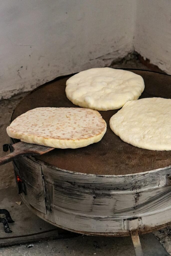 Fresh flatbreads on traditional tandoor